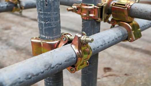 Close-up of scaffold couplers and tube connections